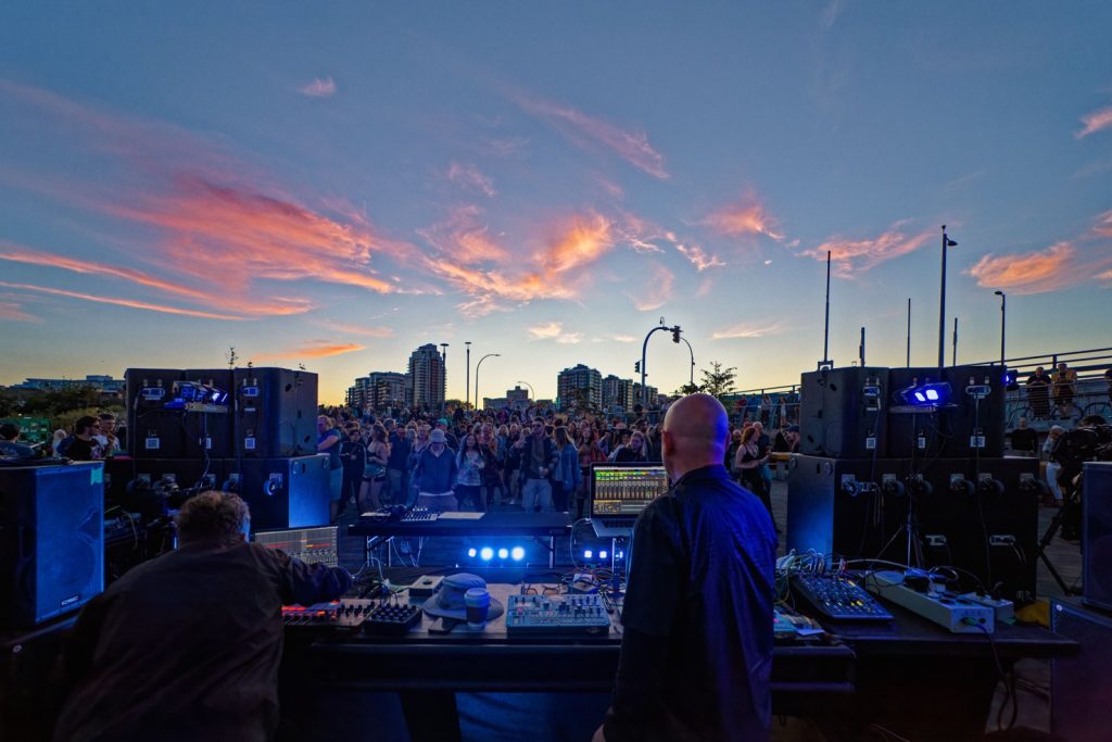 Wonderment event at Songhees Park Plaza / Johnson Street Bridge venue on Saturday, August 2, 2025. Photo taken at the end of Berlin artist Thomas Melchior's set, with BC Artist Tor getting ready to perform on the left.